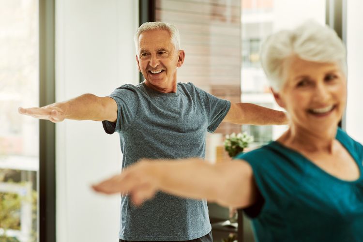 older couple exercising to help influence cancer risk