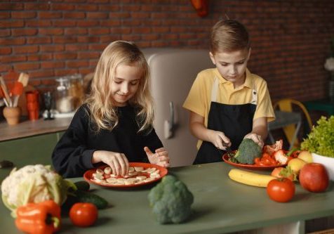 children slicing veg | How to get your child to eat fruits and veggies | Perpetual Wellbeing